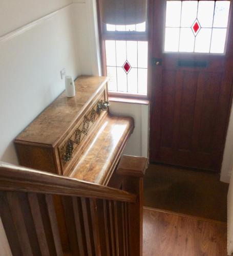 a room with a wooden staircase with a wooden door at Gateway House in Didcot