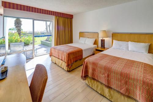Ένα ή περισσότερα κρεβάτια σε δωμάτιο στο Porta Hotel del Lago