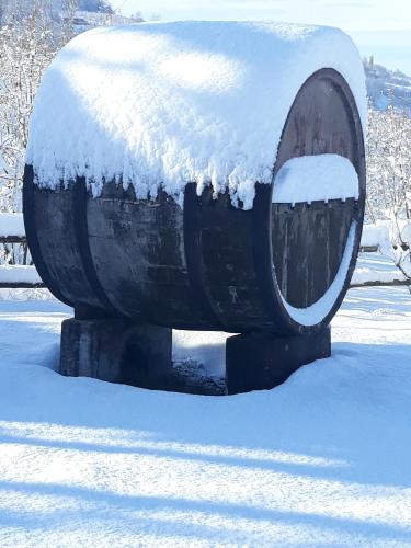 a fire hydrant with snow on top of it at Agriturismo Cascina Binelli in Dogliani