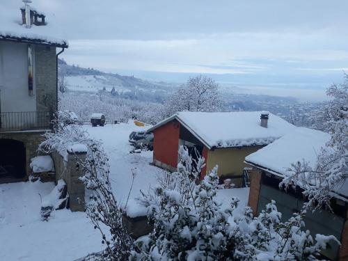 a house with snow on the roof at Agriturismo Cascina Binelli in Dogliani