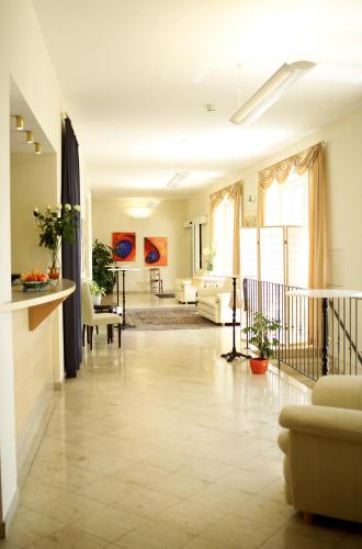 a living room with a couch and a table at Eisenbock's Strasser Hof in Strass