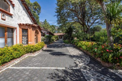 a cobblestone street in front of a building at Regis Hotel Spa in Panajachel