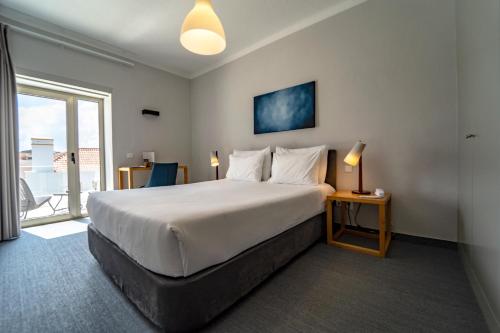 Een bed of bedden in een kamer bij Agua d'Alma Hotel