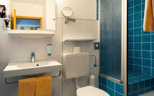 Ein Badezimmer in der Unterkunft Hotel Schleifmühle