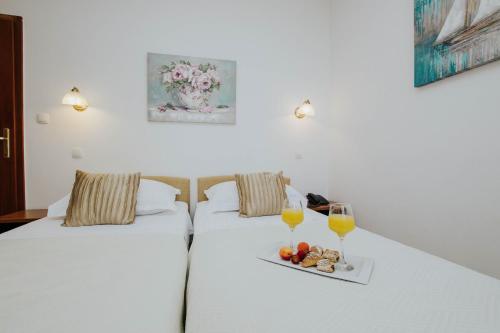 Nápoje v ubytování Hotel Vila Tina