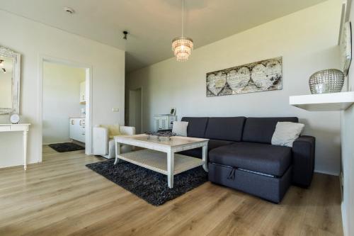 Posezení v ubytování River Apartments