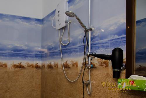 Un baño de VISU VILLA hotel