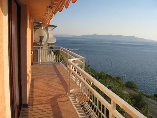 a balcony of a house with a view of the ocean at Apartment Bellavita Senj in Senj