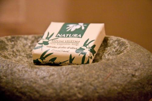 a block of cheese sitting on top of a rock at Contrada Beltramelli in Villa di Tirano