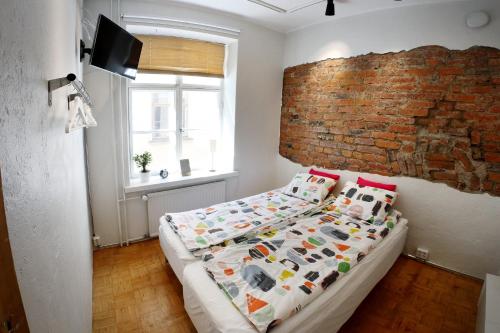 Ένα ή περισσότερα κρεβάτια σε δωμάτιο στο Central Aleksanteri