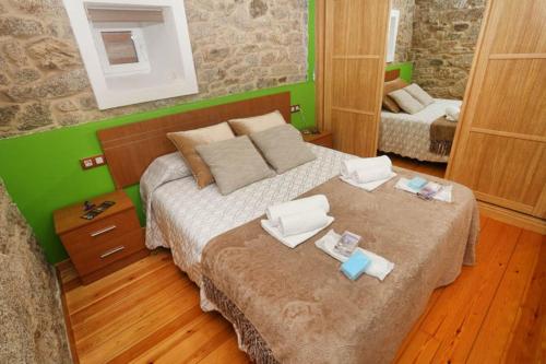 Ένα ή περισσότερα κρεβάτια σε δωμάτιο στο A Casa do Avó