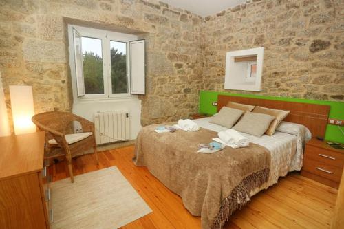 Ένα ή περισσότερα κρεβάτια σε δωμάτιο στο A Casa do Avó