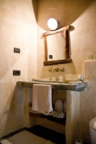 a bathroom with a sink and a mirror at Contrada Beltramelli in Villa di Tirano