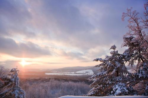 a winter sunset with a bridge in the background at Lake Pointe Inn in McHenry