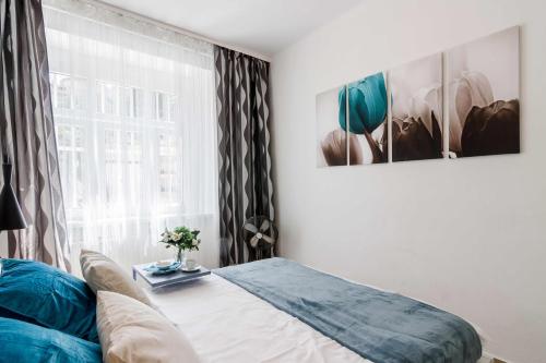 a bedroom with a bed and a window at APT with sunny garden Prague by Michal&Friends in Prague