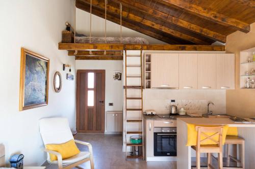 a kitchen with a table and chairs in a room at Apartments Aerodrom in Podgorica