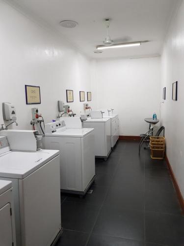 a laboratory with sinks and other appliances in a room at Lae City Hotel in Lae