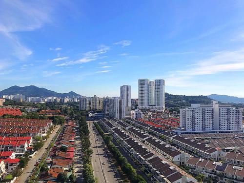 an aerial view of a city with tall buildings at Cozy Home with Spectacular View in Bayan Lepas