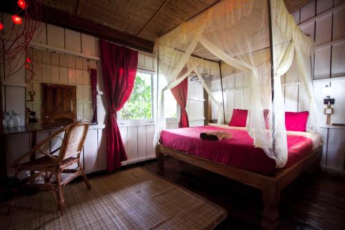 Llit o llits en una habitació de Sabay Beach