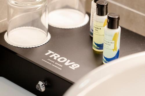 a counter with two bottles of soap and a sink at TROVE Johor Bahru in Johor Bahru