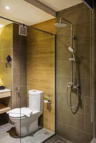 a bathroom with a toilet and a shower at TROVE Johor Bahru in Johor Bahru