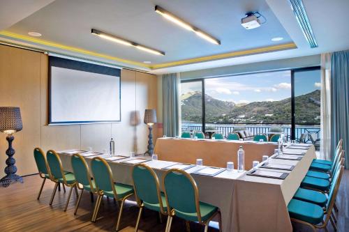 a large meeting room with a long table and chairs at Dolce by Wyndham Athens Attica Riviera in Vravrona