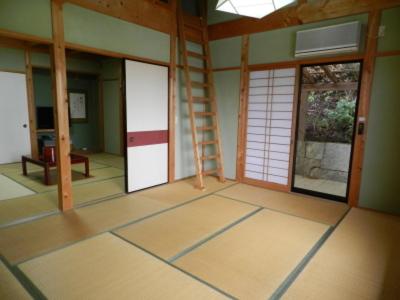 an empty room with doors and a ladder in it at Hiogiso in Shima