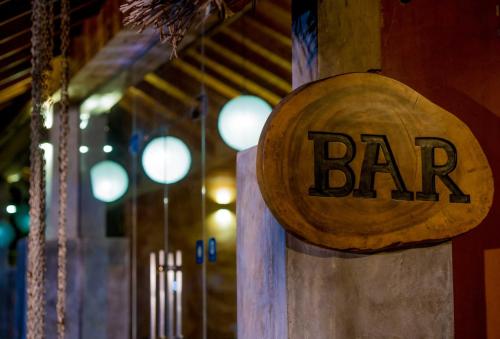 a sign that says bar on the side of a building at Miracle Resorts & Villas in Polonnaruwa