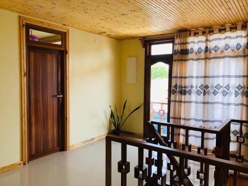 a room with a staircase and a door with a window at Mariana Maldives in Gaafaru