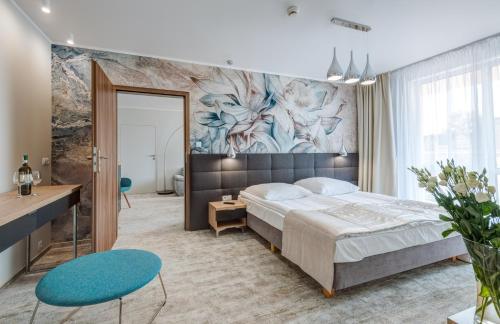 Postel nebo postele na pokoji v ubytování Hotel Zorza