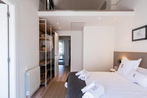 Tempat tidur dalam kamar di Petit Luxe Tobella Esquerra