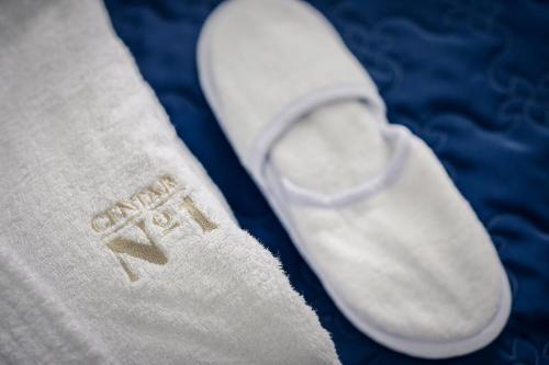 a close up of a pair of white socks and a shoe at Hotel Centar No.1 in Belgrade