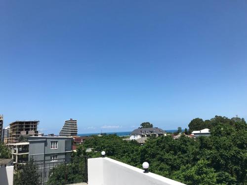 a view of a city from the roof of a building at Hotel CHARLI in Gonio