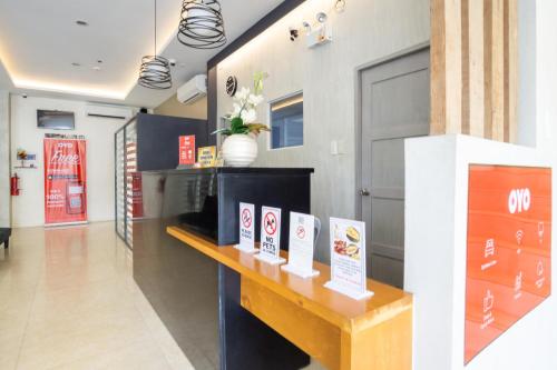 a room with a table with signs on it at 18 Suites Cebu in Cebu City