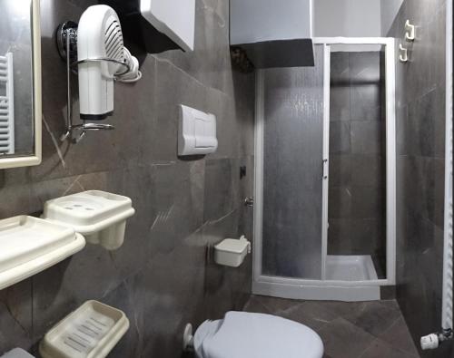 a bathroom with a toilet and a sink and a shower at Non ditelo al Duca - Belvedere Sant'Angelo in Spoleto