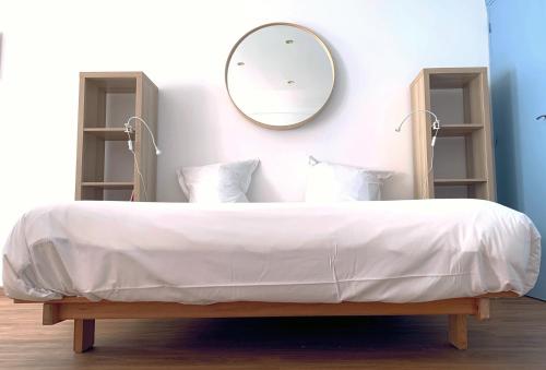Postel nebo postele na pokoji v ubytování La Chambre Bleue