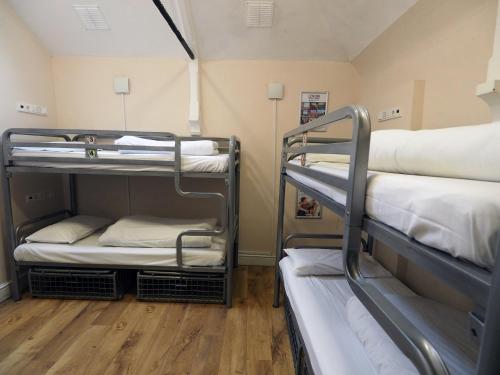 Bed in 4-Bed Female Dormitory Room with Shared Bathroom