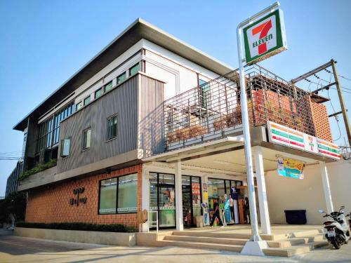 a building with a balcony on the side of it at Asleep by Lantana in North Pattaya