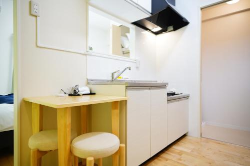 Una cocina o zona de cocina en Condominium GOLF GOLF Tsuboya