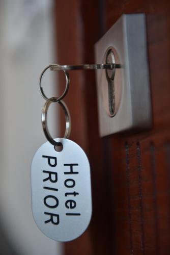a key chain with the word unlock on it at Prior Hotel in Prizren