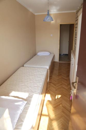 a small bedroom with two beds in a room at Apartment 51 in Gornji Karin
