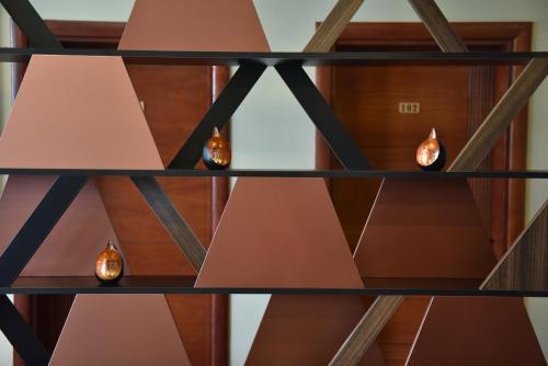 a shelf with several lights on it at Prior Hotel in Prizren