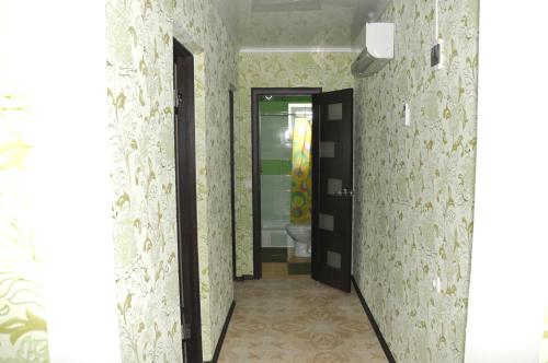 a hallway with a bathroom with a toilet in it at Solnechnaia Dacha in Zatoka