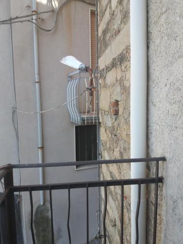 a balcony of a building with a window at Monolocale in via San Sebastiano Ficarra in Ficarra