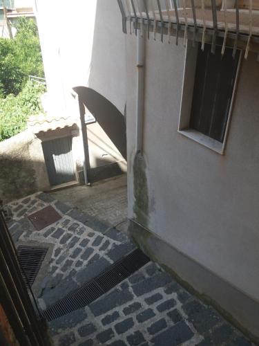 an outside view of a building with a drain at Monolocale in via San Sebastiano Ficarra in Ficarra