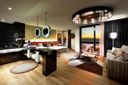 a living room with a desk with mirrors on the wall at Hard Rock Hotel Tenerife in Adeje