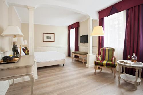 Postel nebo postele na pokoji v ubytování Hotel Leon d'Oro