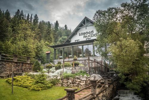 a building with a sign that reads llords village at Lobogo Resort in Vlăhiţa