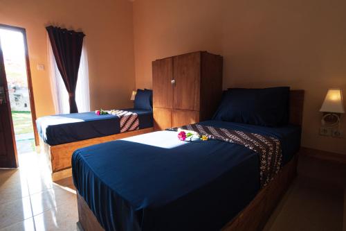 Postel nebo postele na pokoji v ubytování Surf Camp 79