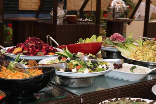 a buffet filled with many different types of food at Olive Tree Amman in Amman